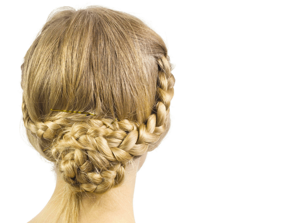 woman modeling french braided updo with a bun
