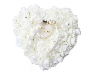 White Lace Wedding Ring Pillow. Fabric is shaped like white roses.