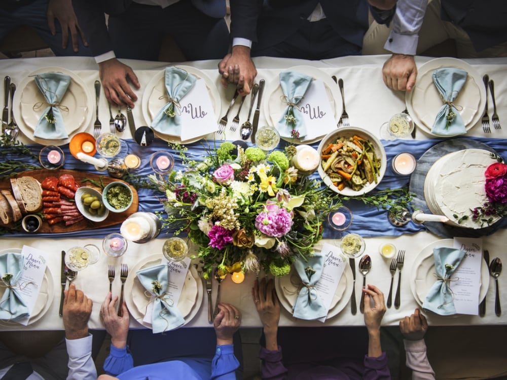 A flat lay angle of people at a table eating