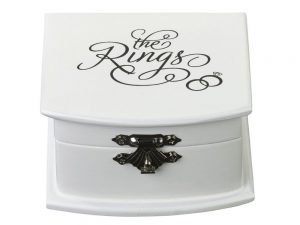 White Ring Bearer Box with the rings in black writing on the lid.