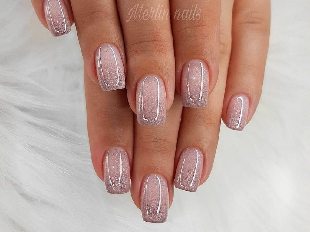 Natural color wedding nails transitioning to a dark faded color.