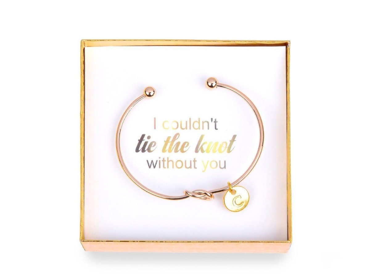 Charm Bracelet in a box with a note saying I wouldn't tie the knot without you.