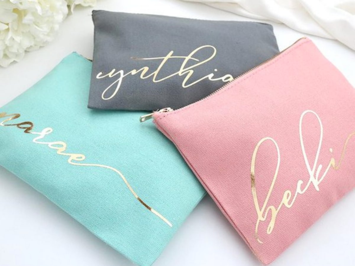Custom Makeup Bags with the names of your bridesmaids on them.