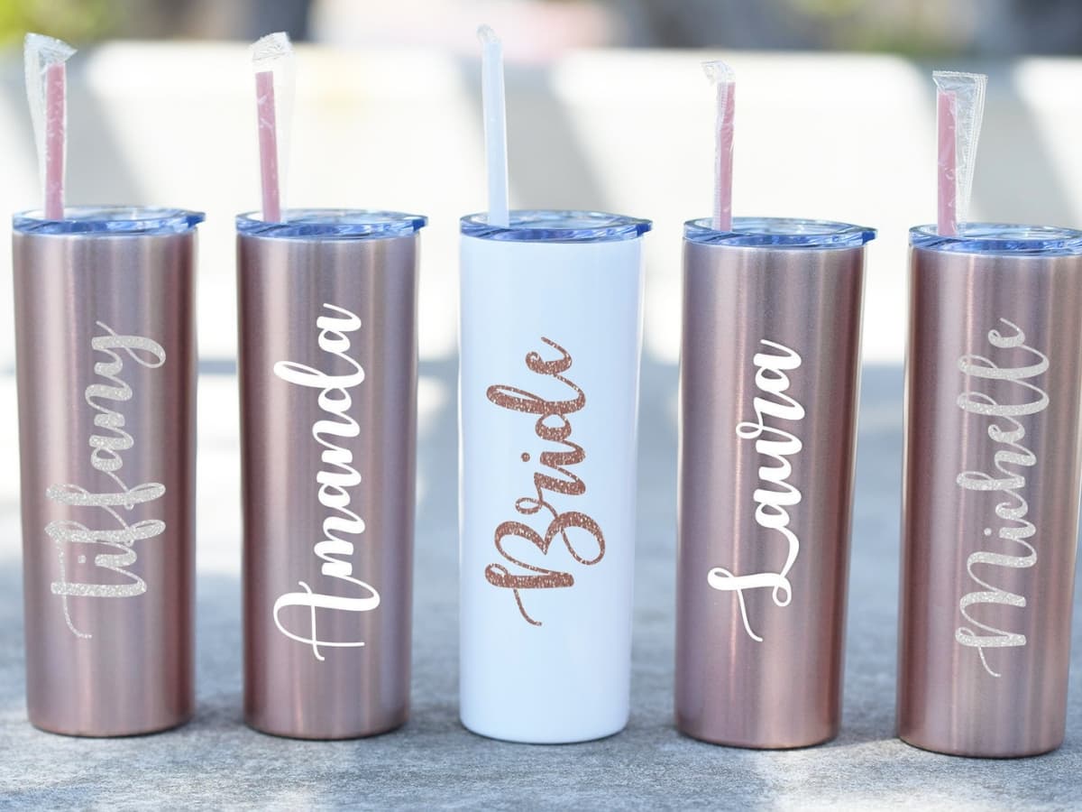 Custom bridesmaid cups that have the bridesmaids names on them.