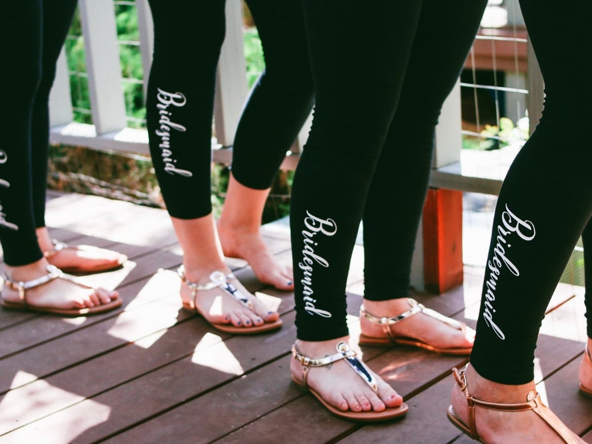 Black Leggings with the word bridesmaid down the leg in white.