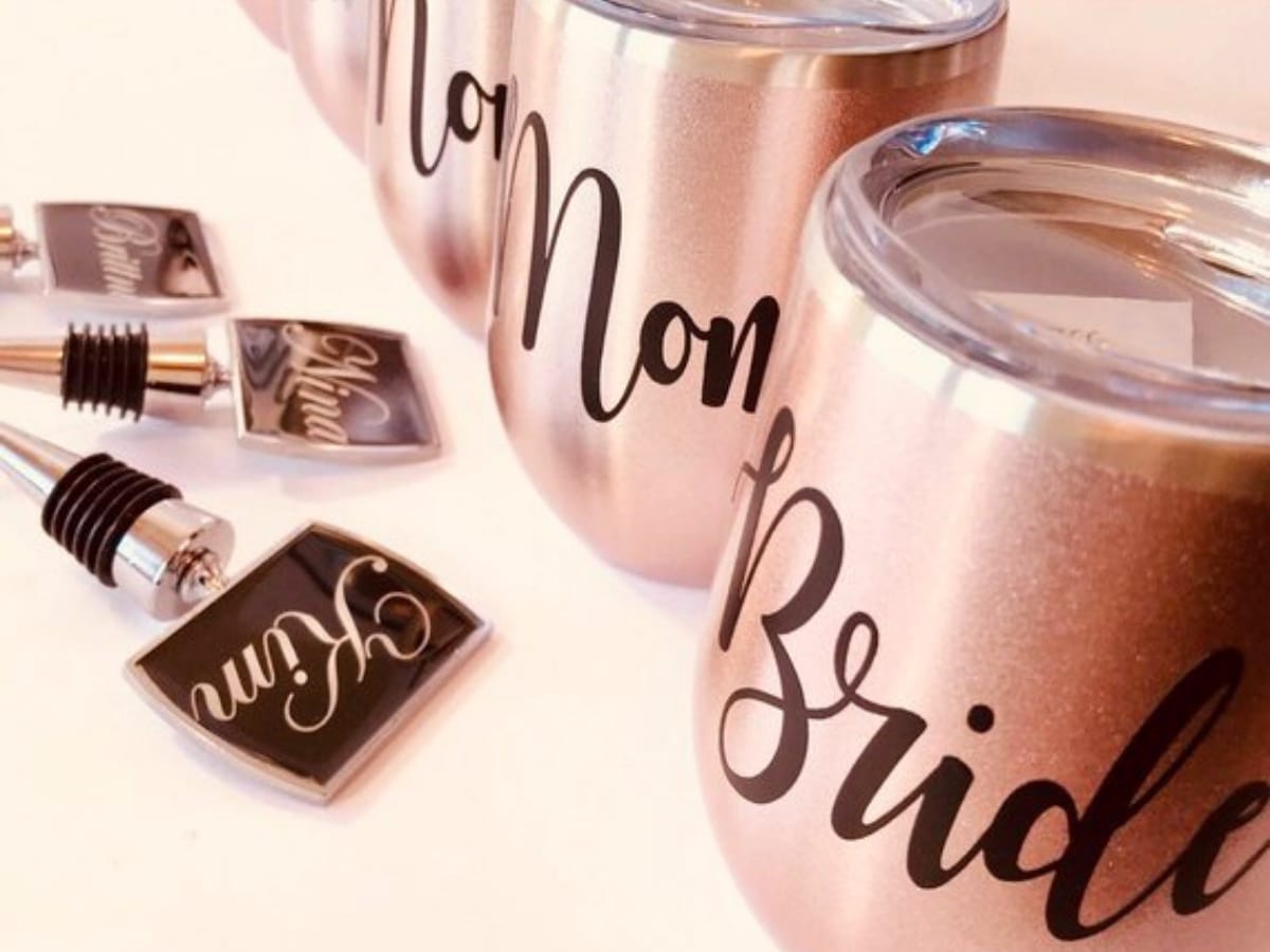 Wine Tumbler glasses with the names of your bridesmaids on them.