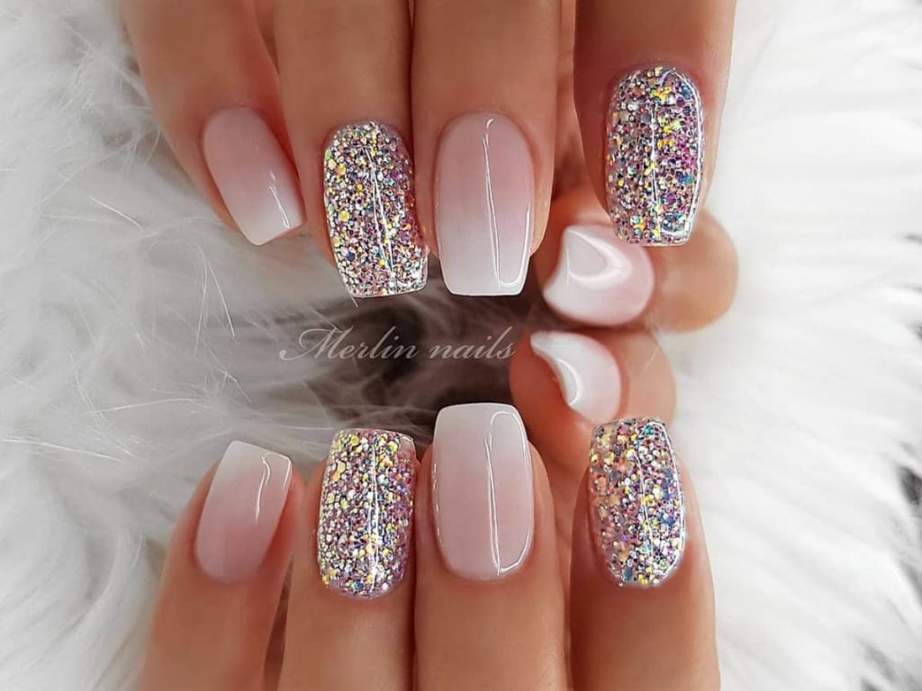 Natural to white fade color with glitter painted artwork fingernails.